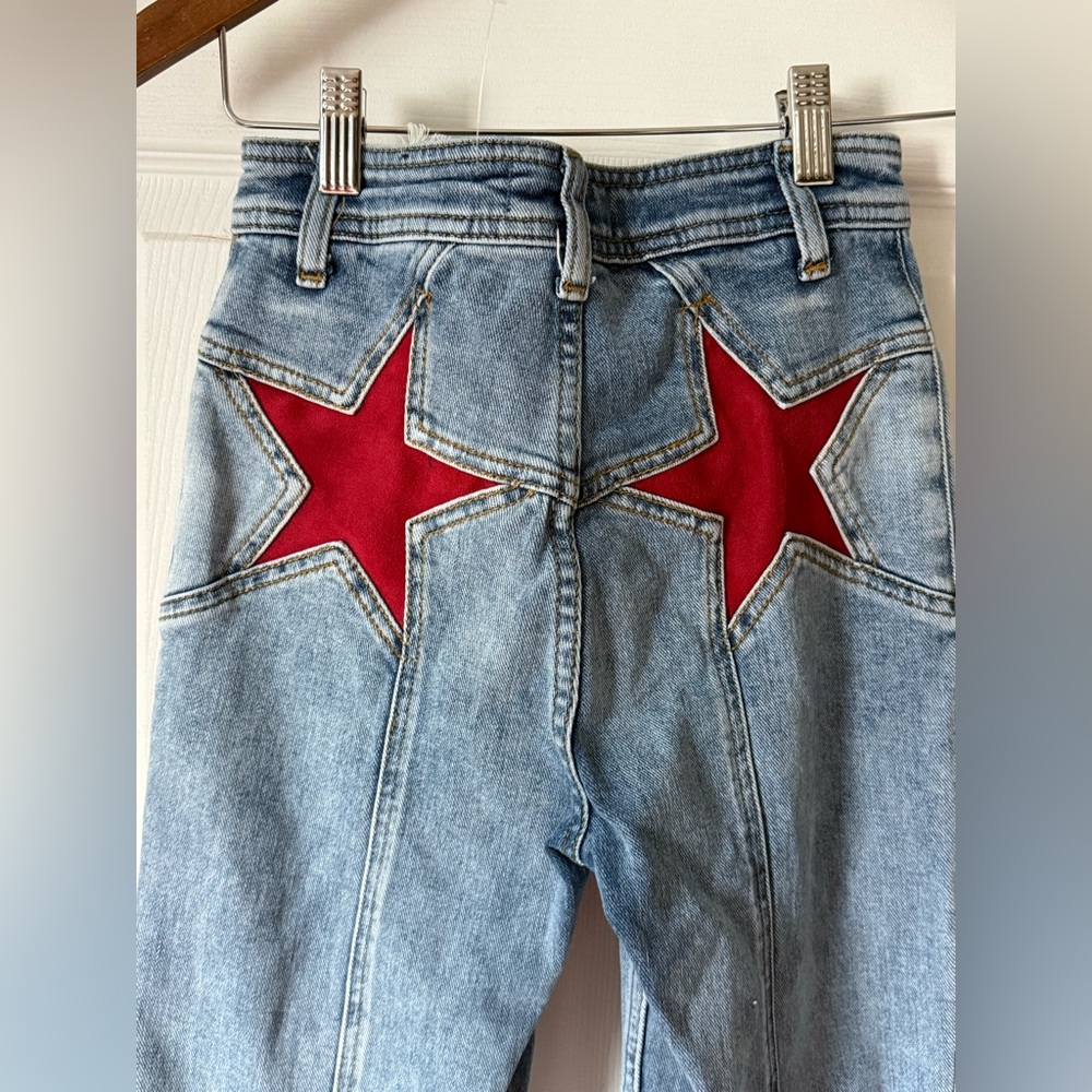 Free People Light Blue Flare Jeans with Red Star Details